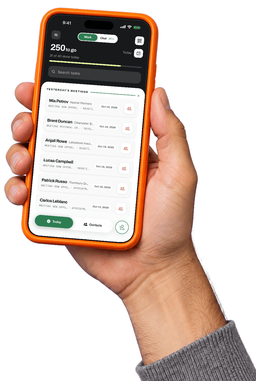 A hand holding a phone with the Booked55 app open